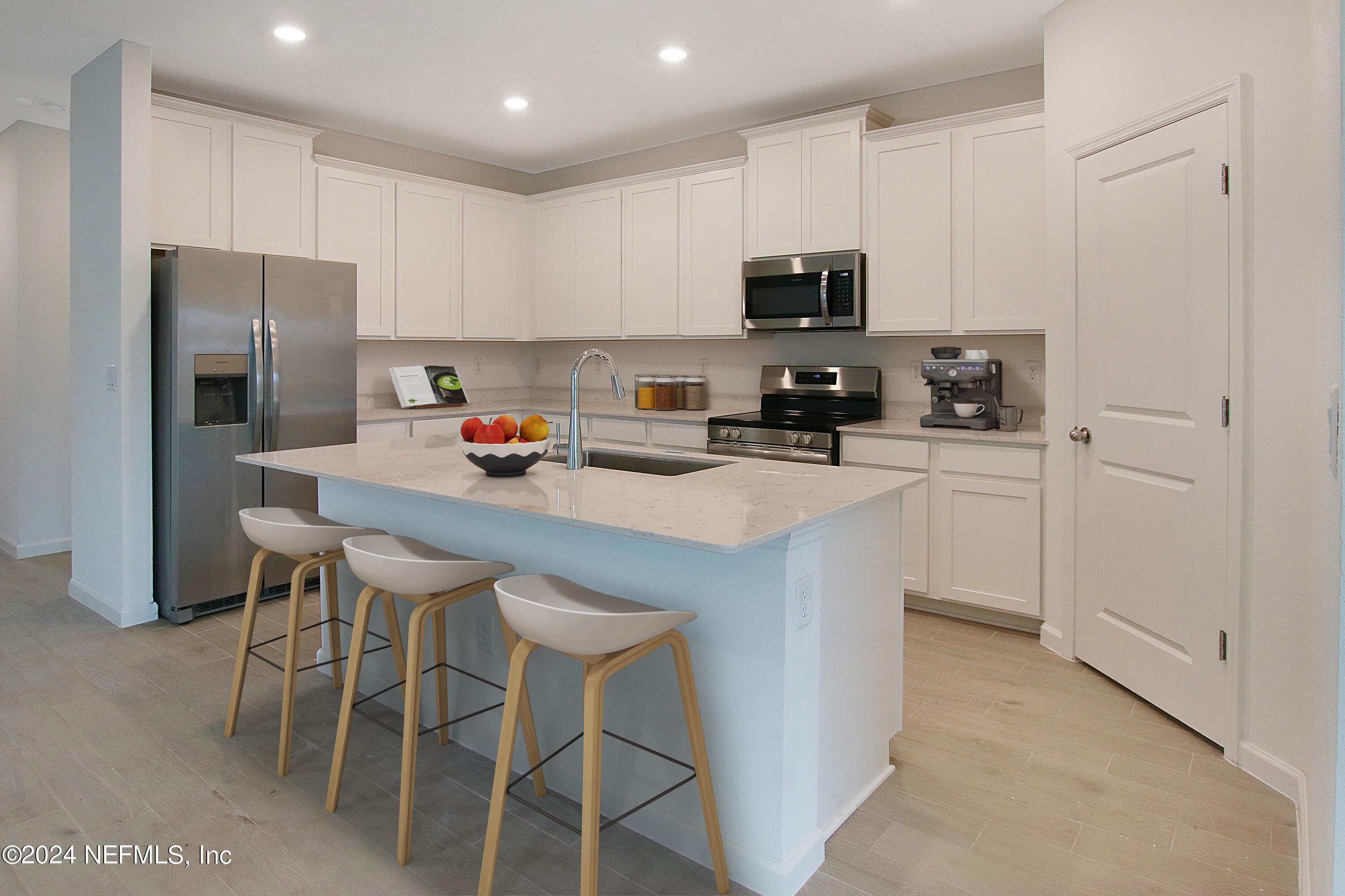 299 Pentwater Road St. Augustine, FL 32092 - Photo 22 of 36 a kitchen with stainless steel appliances a microwave a sink and refrigerator