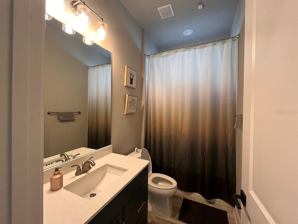 12149 Southwest 33rd Place Gainesville, FL 32608 - Photo 21 of 35 a bathroom with a sink a toilet and shower