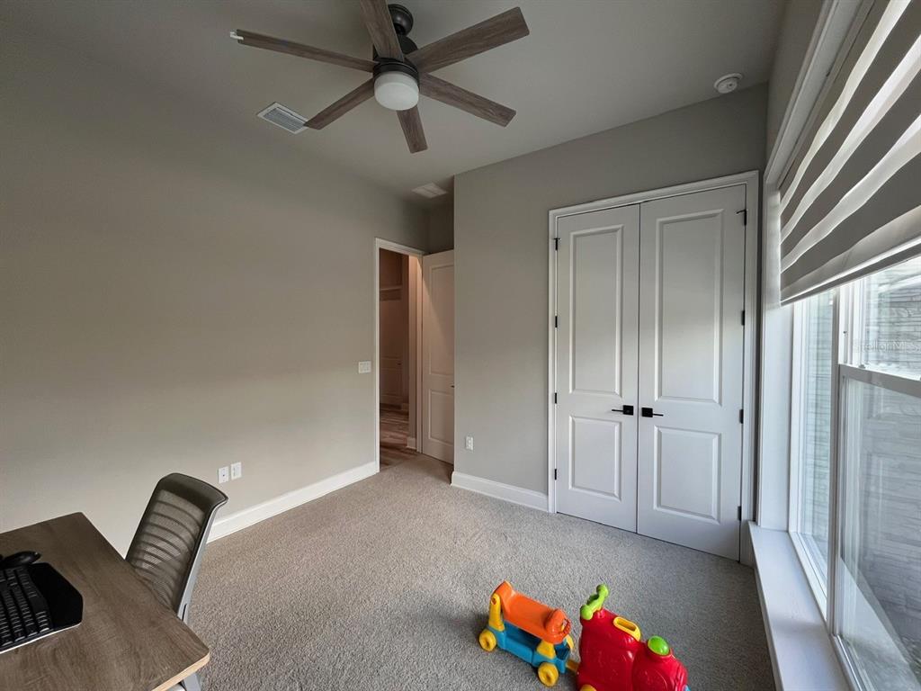 12149 Southwest 33rd Place Gainesville, FL 32608 - Photo 23 of 35 wooden floor in an empty room with a window