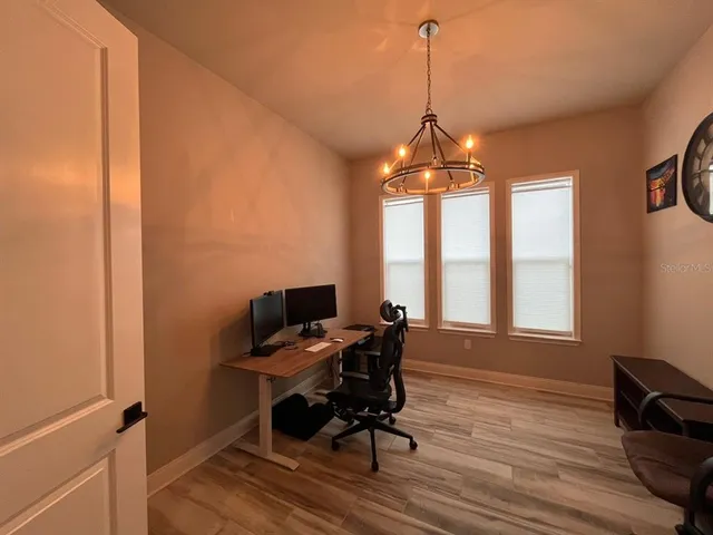 a workspace with wooden floor