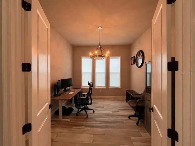 a view of a livingroom with furniture and front door