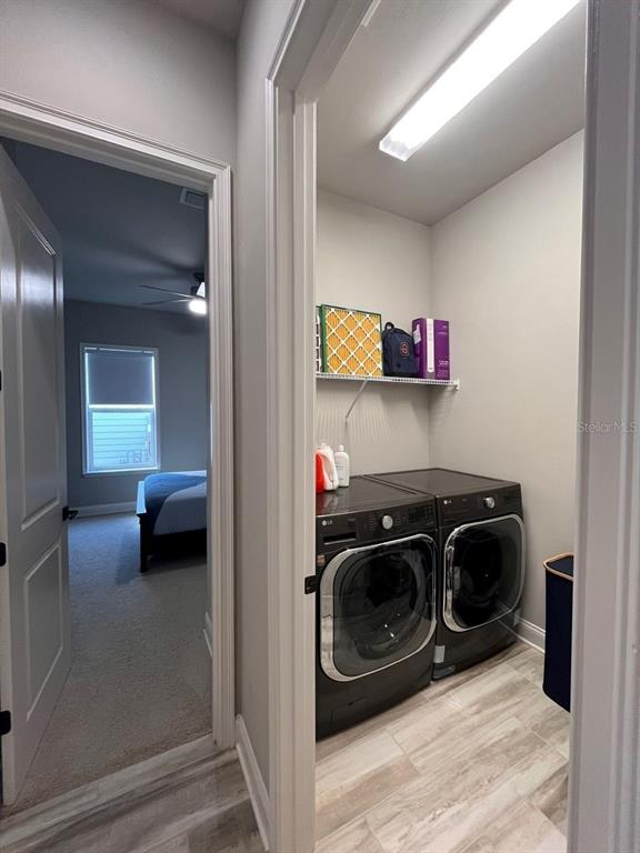 12149 Southwest 33rd Place Gainesville, FL 32608 - Photo 32 of 35 a utility room with a washer and dryer