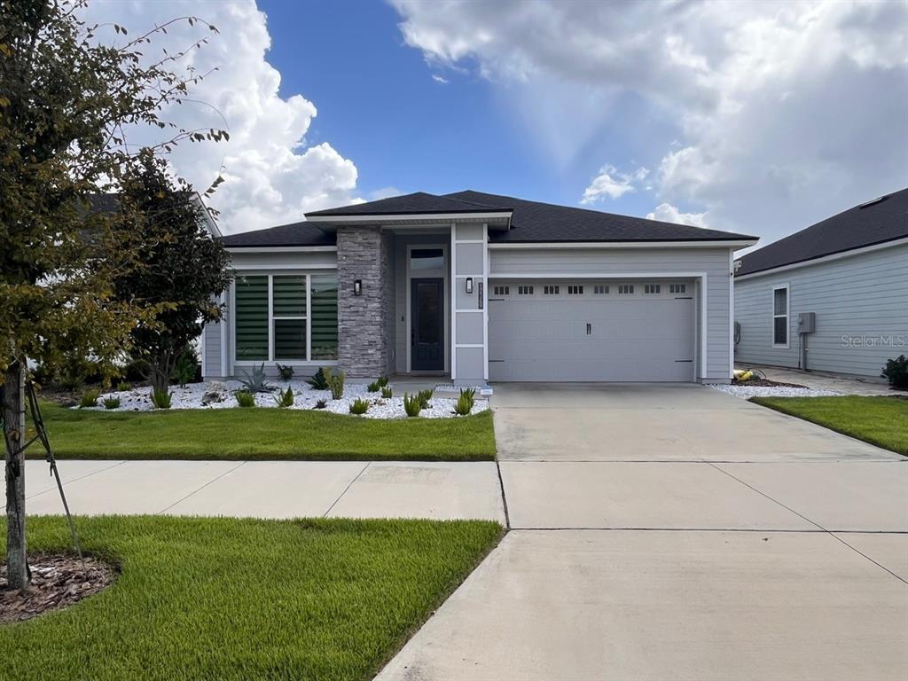 12149 Southwest 33rd Place Gainesville, FL 32608 - Photo 35 of 35 a front view of house with a garden