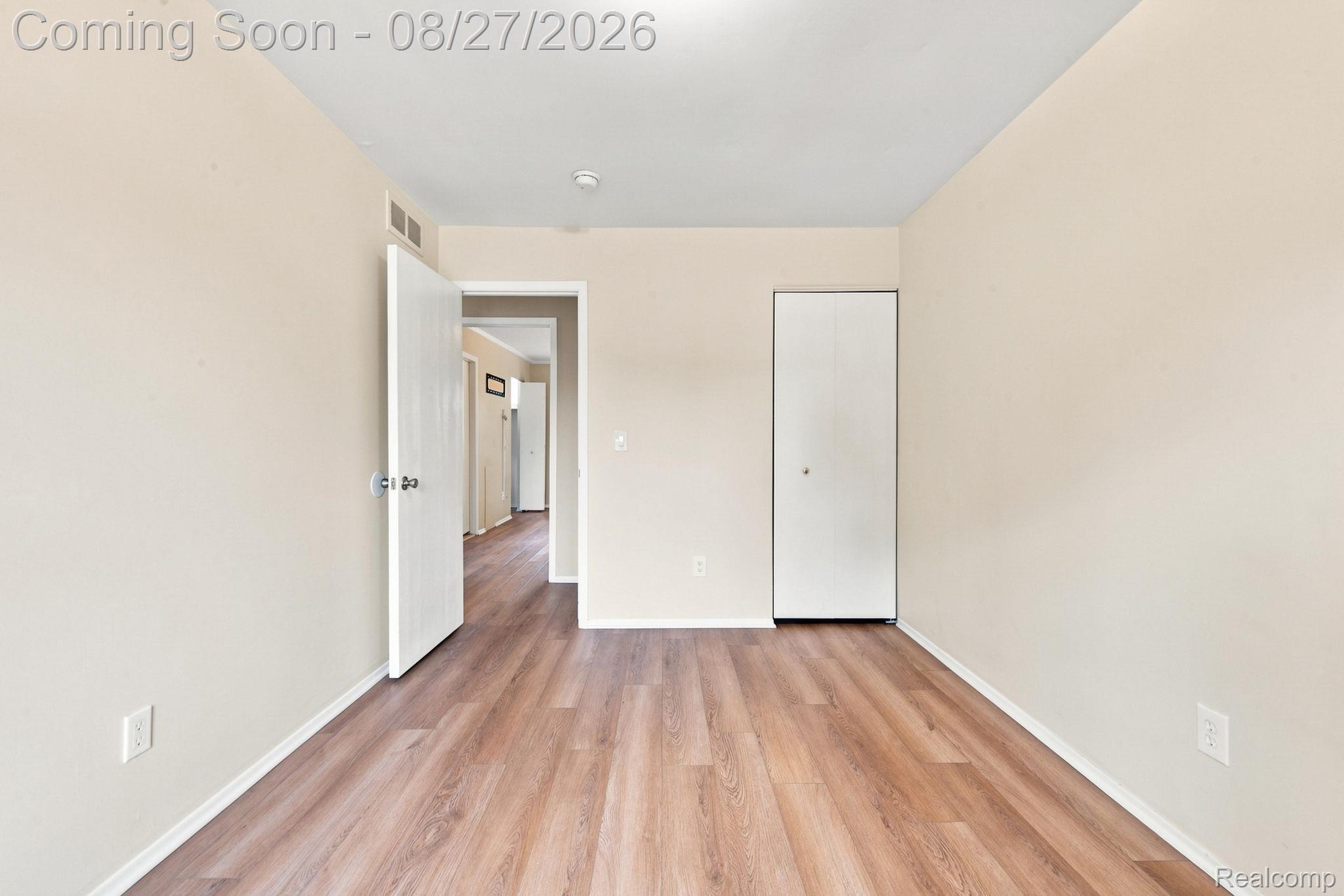 42120 Ridge Road West Novi, MI 48375 - Photo 26 of 32 Wood-finish flooring, neutral wall tones, and overhead lighting