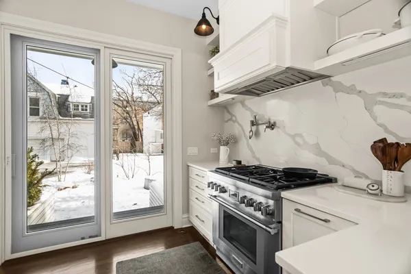 a view of a kitchen with a large window