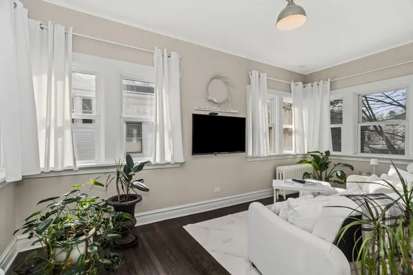 a room with furniture and a wooden floor