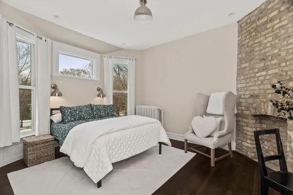 a bedroom with two beds and a window