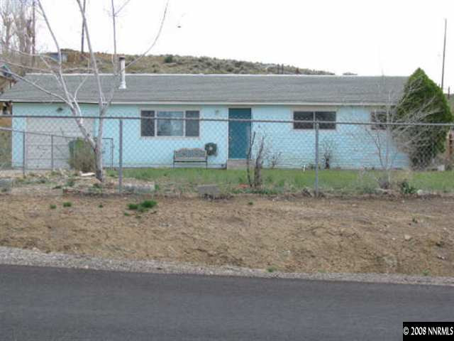 126 Bernoulli Street Reno, NV 89506 - Photo 1 of 5 a view of a house with a backyard and bushes