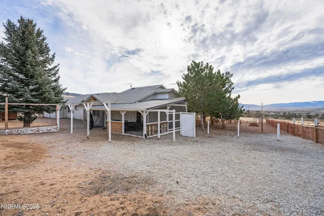 a view of a house with a backyard