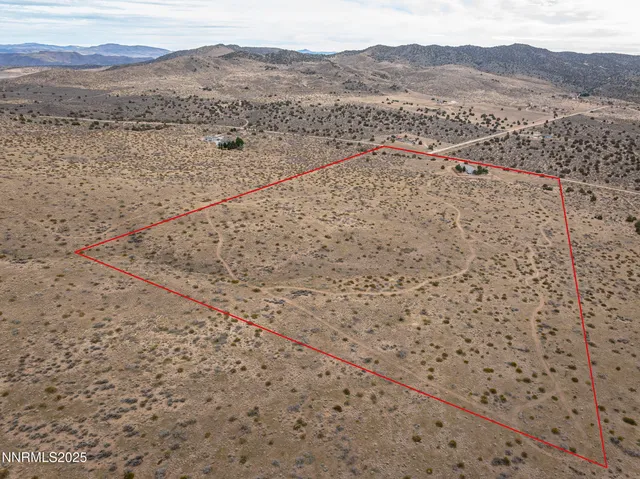 a view of an ocean beach and mountain
