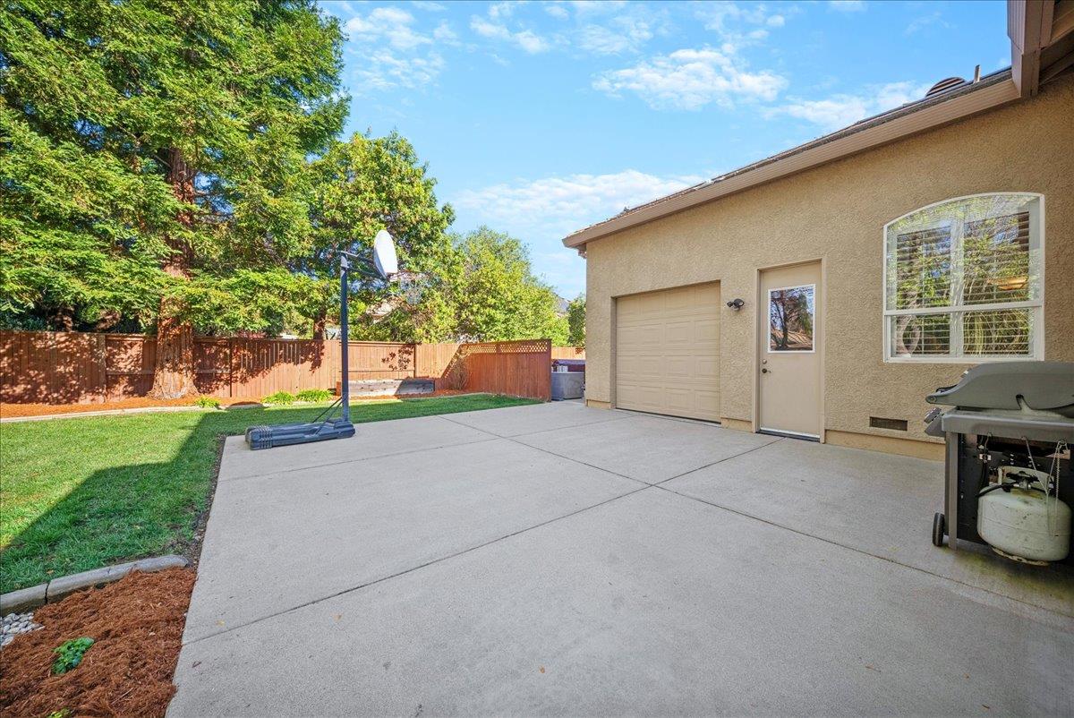 9133 Cedar Ridge Drive Granite Bay, CA 95746 - Photo 34 of 55 rear garage door space of pass-through garage