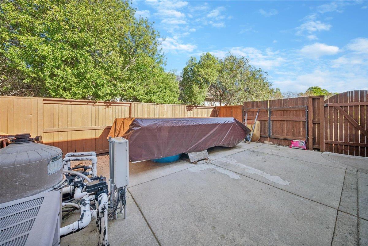 9133 Cedar Ridge Drive Granite Bay, CA 95746 - Photo 36 of 55 wide side yard with swing gates and finished cemented area for RV, boat, trailer, etc.