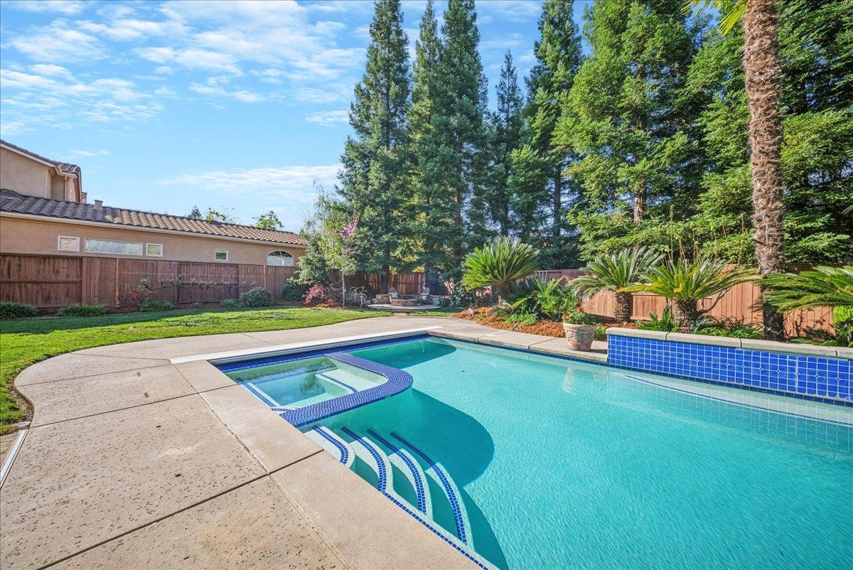 9133 Cedar Ridge Drive Granite Bay, CA 95746 - Photo 45 of 55 Sparkling solar heated pool with built-in spa