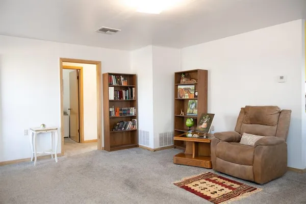 a view of an empty room with shelves