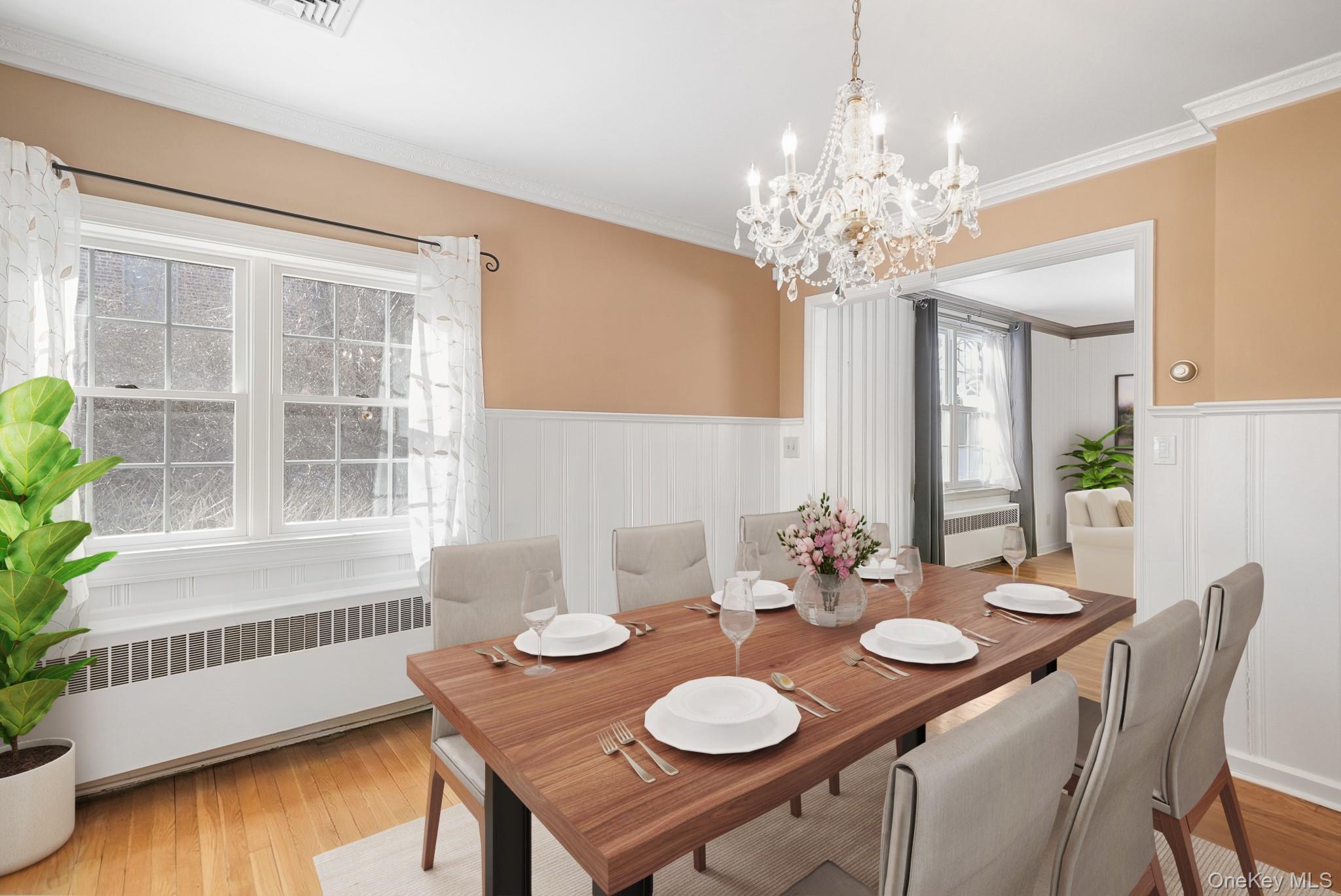 100 Yale Road Hartsdale, NY 10530 - Photo 11 of 42 a view of a dining room with furniture a chandelier and wooden floor