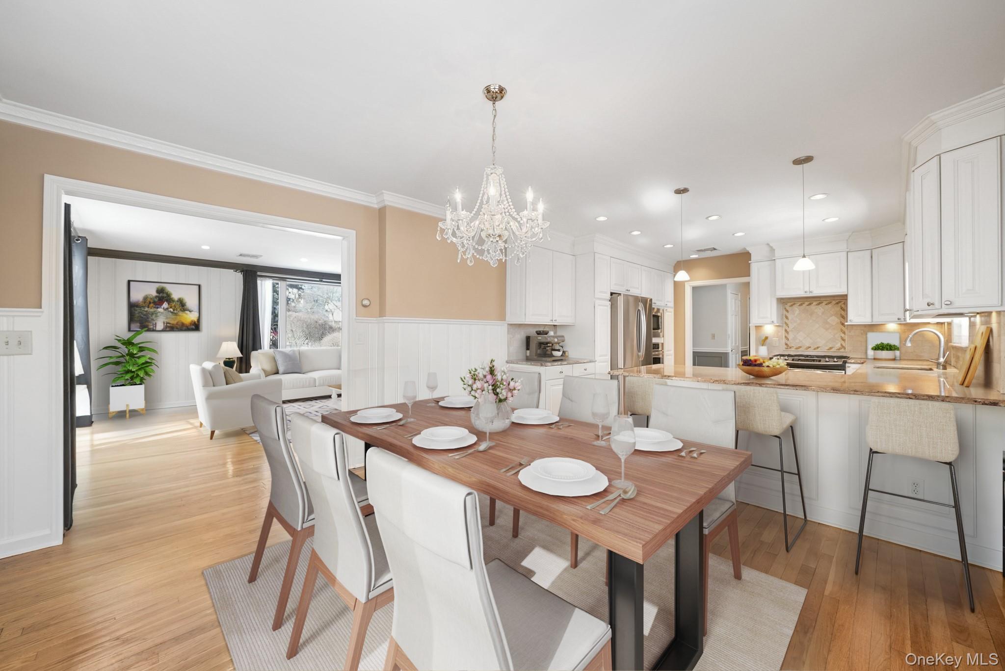 100 Yale Road Hartsdale, NY 10530 - Photo 13 of 42 a view of a dining room and livingroom with furniture wooden floor a chandelier