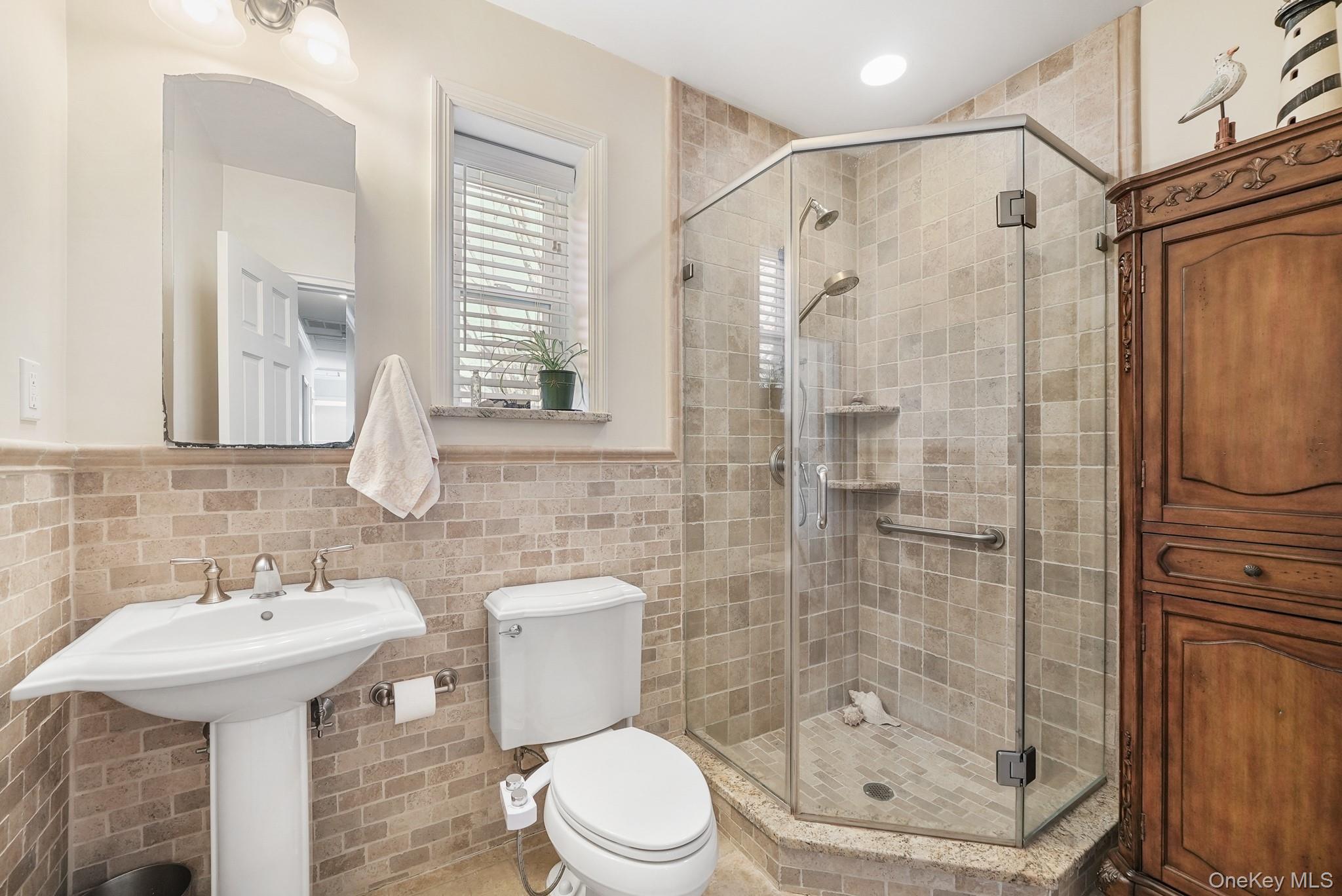 100 Yale Road Hartsdale, NY 10530 - Photo 22 of 42 a bathroom with a shower toilet and sink