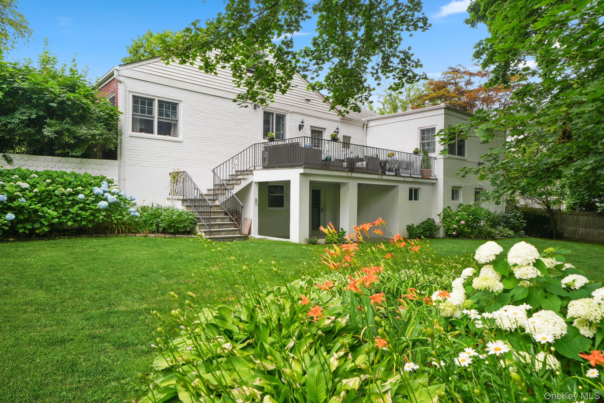 100 Yale Road Hartsdale, NY 10530 - Photo 39 of 42 a front view of a house with a garden
