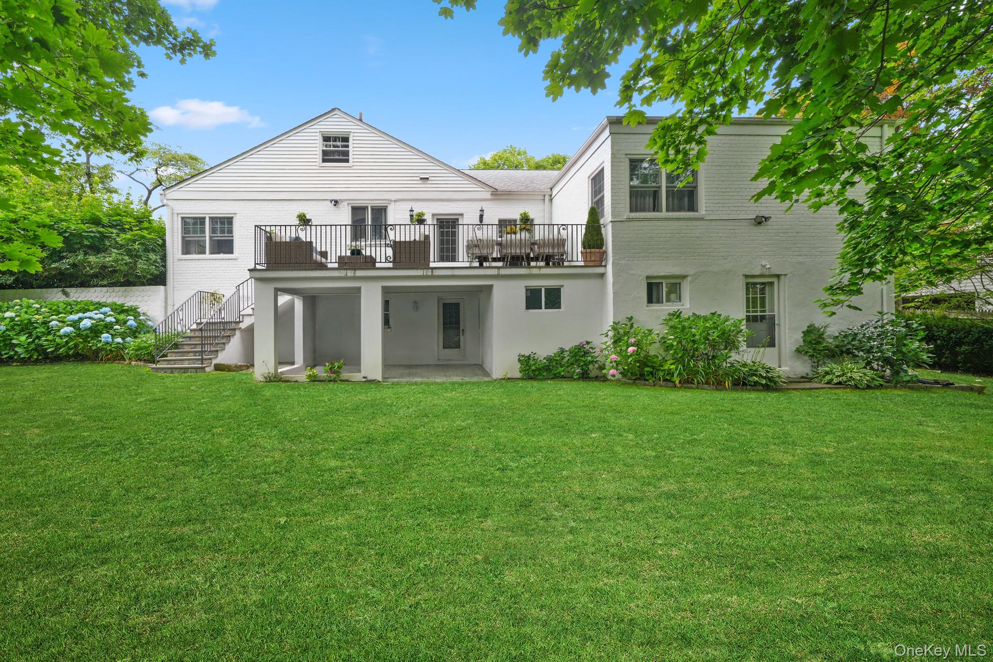 100 Yale Road Hartsdale, NY 10530 - Photo 40 of 42 a front view of a house with a yard and trees