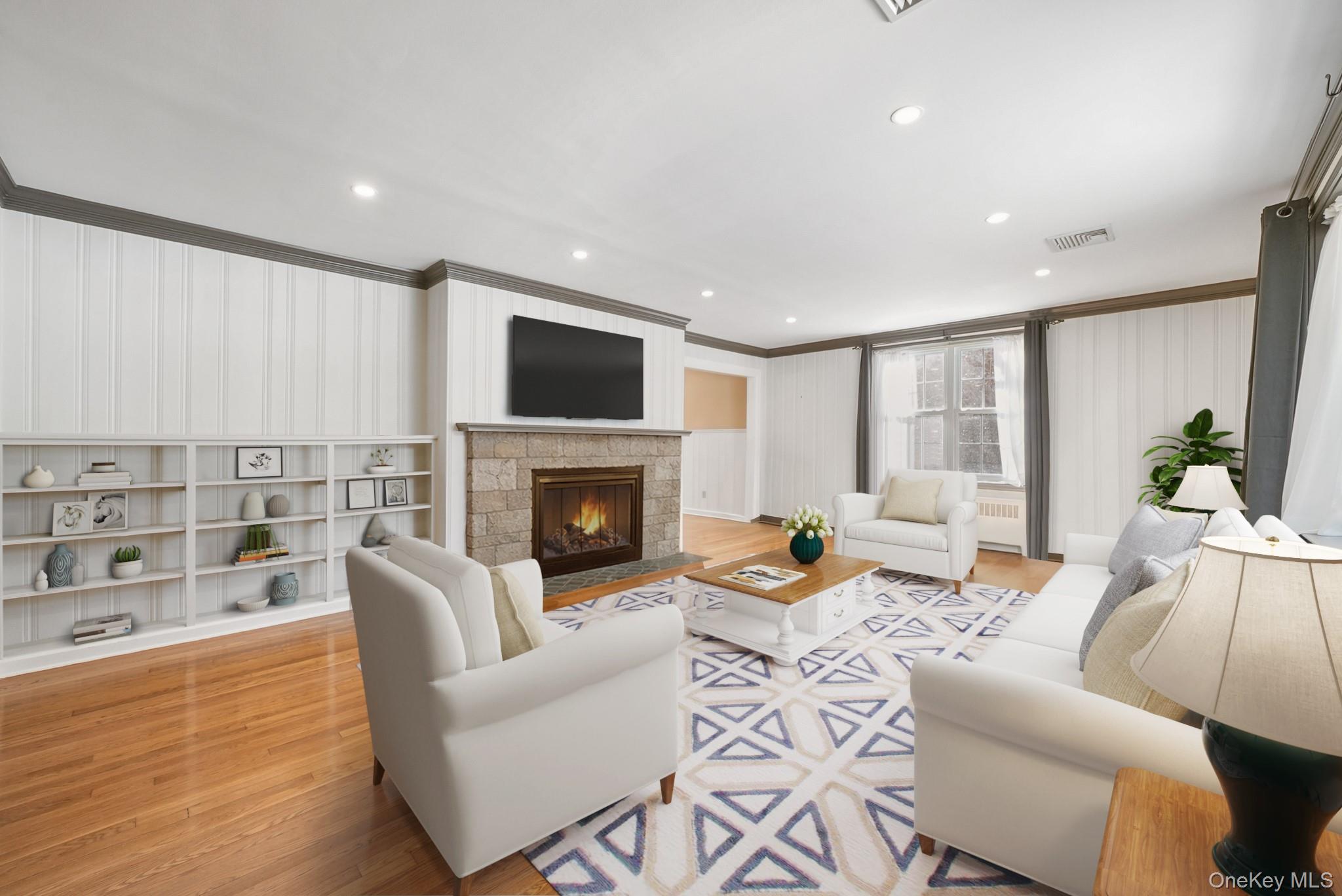 100 Yale Road Hartsdale, NY 10530 - Photo 8 of 42 a living room with furniture a fireplace and a flat screen tv