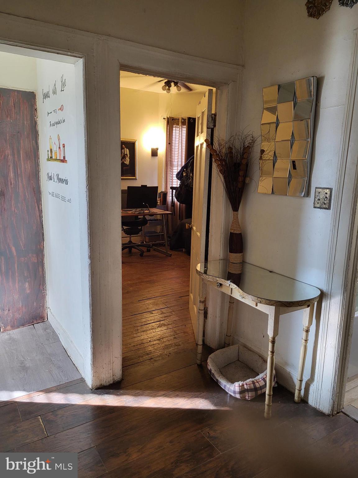 2806 Chelsea Terrace Baltimore, MD 21216 - Photo 15 of 36 a living room with furniture and a wooden floor