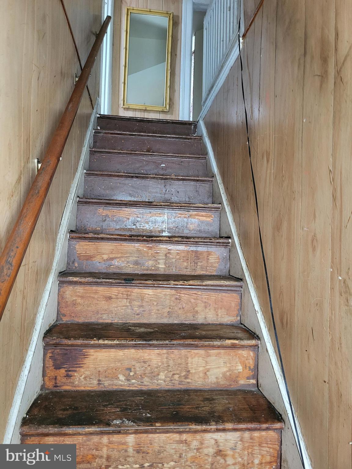 2806 Chelsea Terrace Baltimore, MD 21216 - Photo 21 of 36 a view of staircase with white walls and a rug