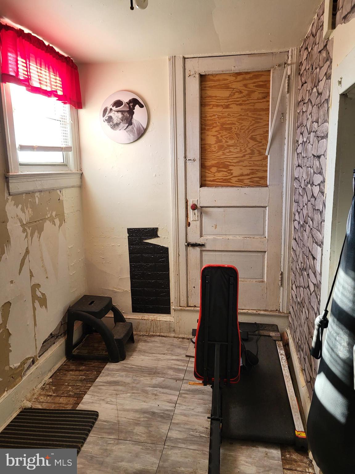 2806 Chelsea Terrace Baltimore, MD 21216 - Photo 22 of 36 a living room with furniture and a fireplace