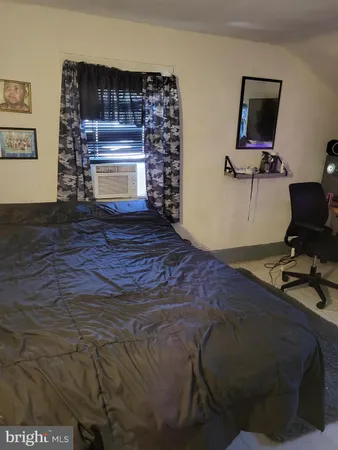 a bed sitting in a room next to a window