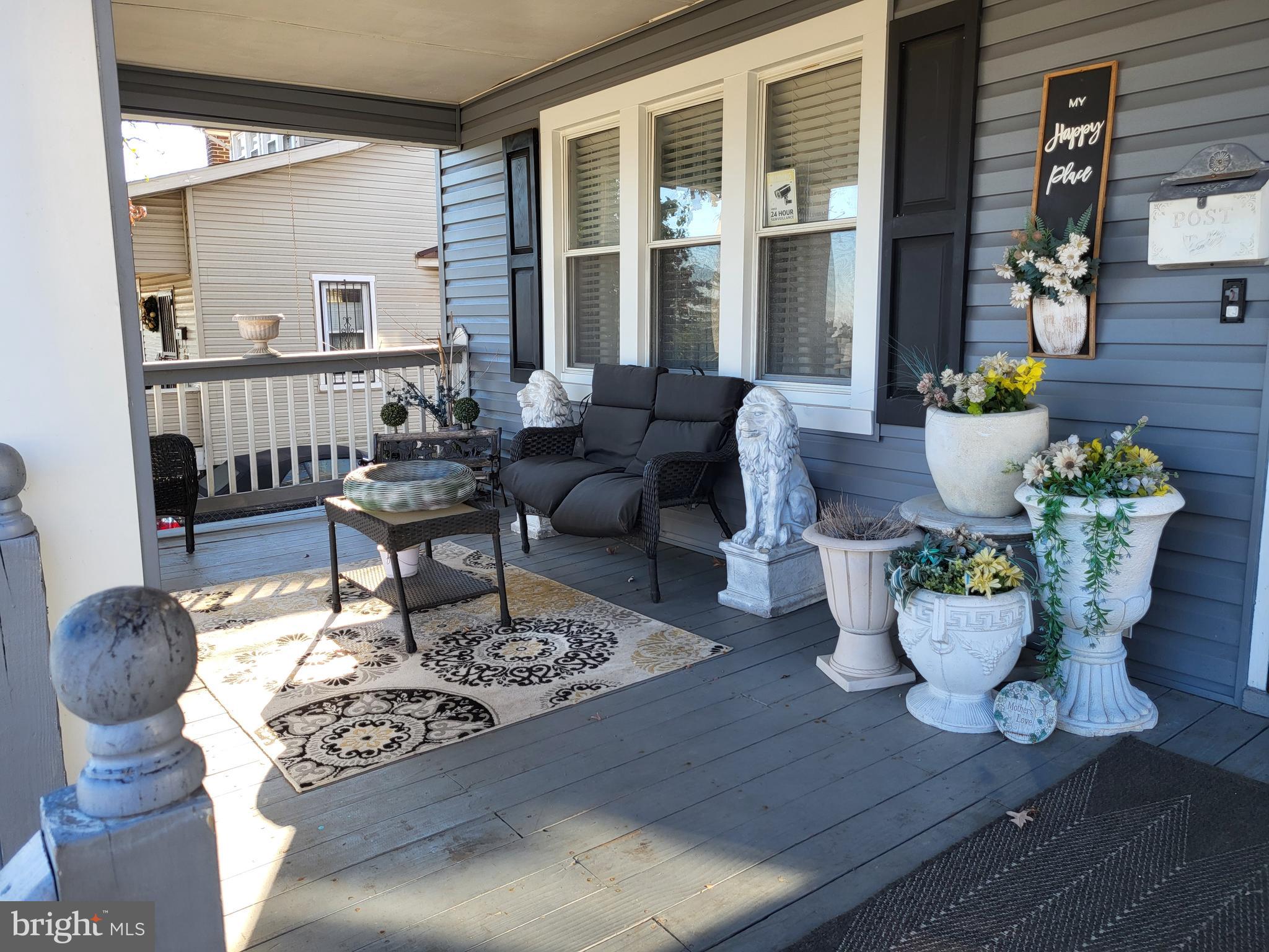 2806 Chelsea Terrace Baltimore, MD 21216 - Photo 5 of 36 a living room with furniture a table and a potted plant