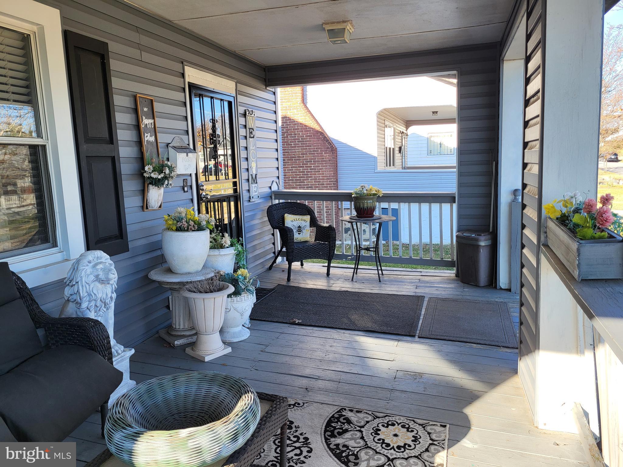 2806 Chelsea Terrace Baltimore, MD 21216 - Photo 6 of 36 a living room with furniture and a potted plant