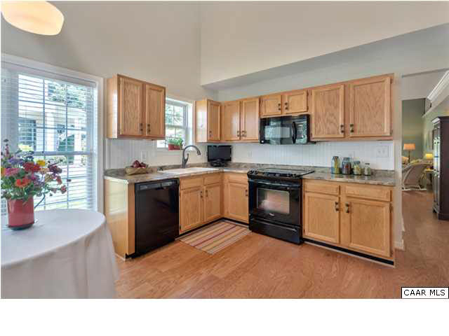 976 Devon Spring Court Charlottesville, VA 22903 - Photo 12 of 33 The kitchen has also been updated and features new countertops, a new cast iron sink, new faucet, and new high end appliances.