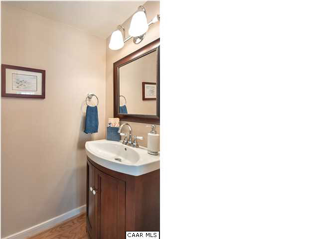 976 Devon Spring Court Charlottesville, VA 22903 - Photo 17 of 33 The main level powder bath has been redone as well and includes a new sink with cherry cabinet, new toilet, hardwood floors and all new fixtures.