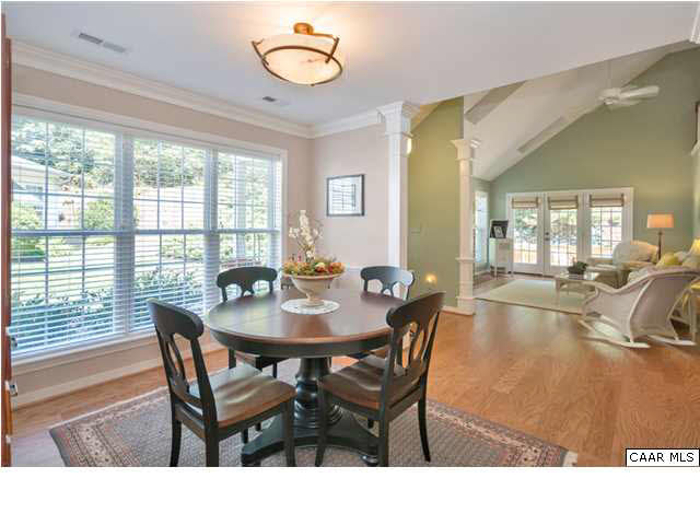 976 Devon Spring Court Charlottesville, VA 22903 - Photo 6 of 33 Off the main entrance you'll be welcomed into a bright sunny dining room on one side and a spacious cozy family room on the other with a brick surround gas fireplace and french doors to the outdoor living space.
