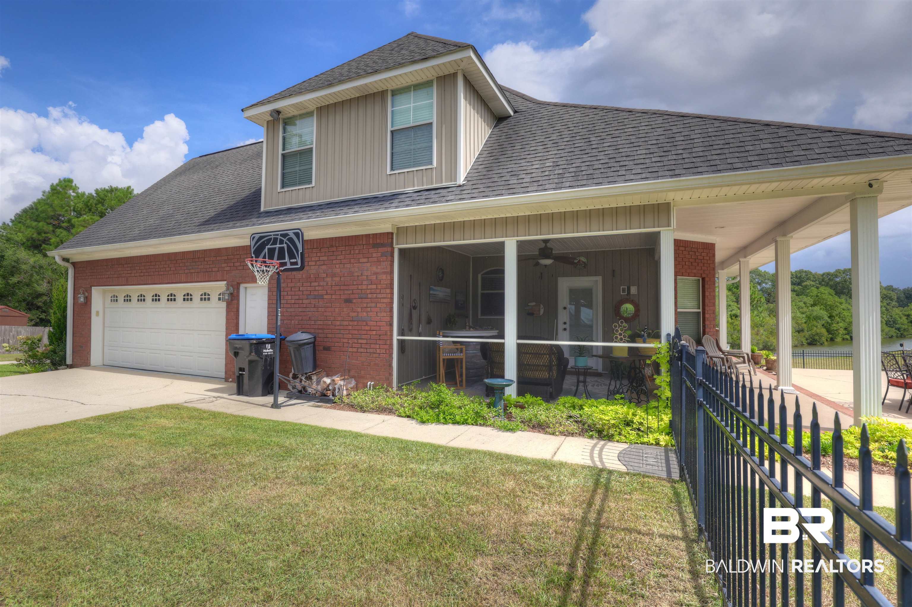 5565 Dawes Lane Theodore, AL 36582 - Photo 28 of 38 View of front of house with a garage, a front lawn, and ceiling fan