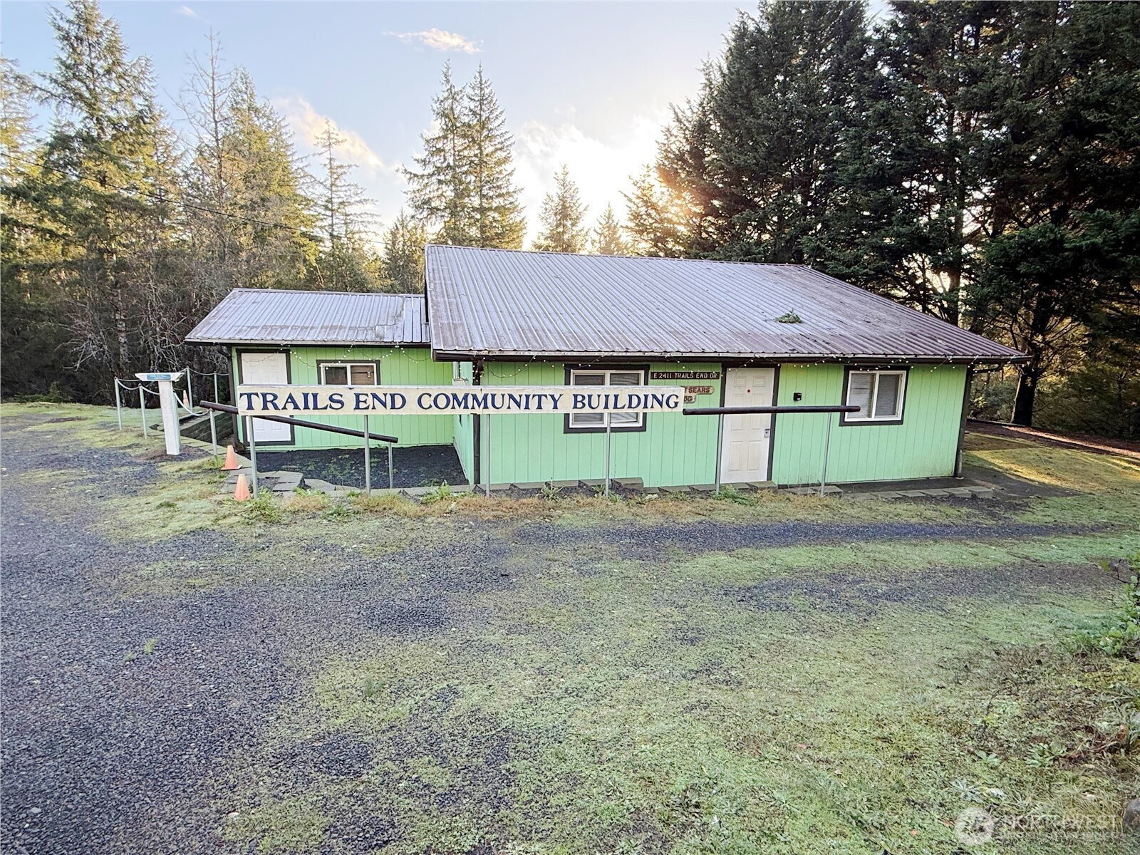 550 E Trail Belfair, WA 98528 - Photo 11 of 11 a view of a house with a yard and a large tree