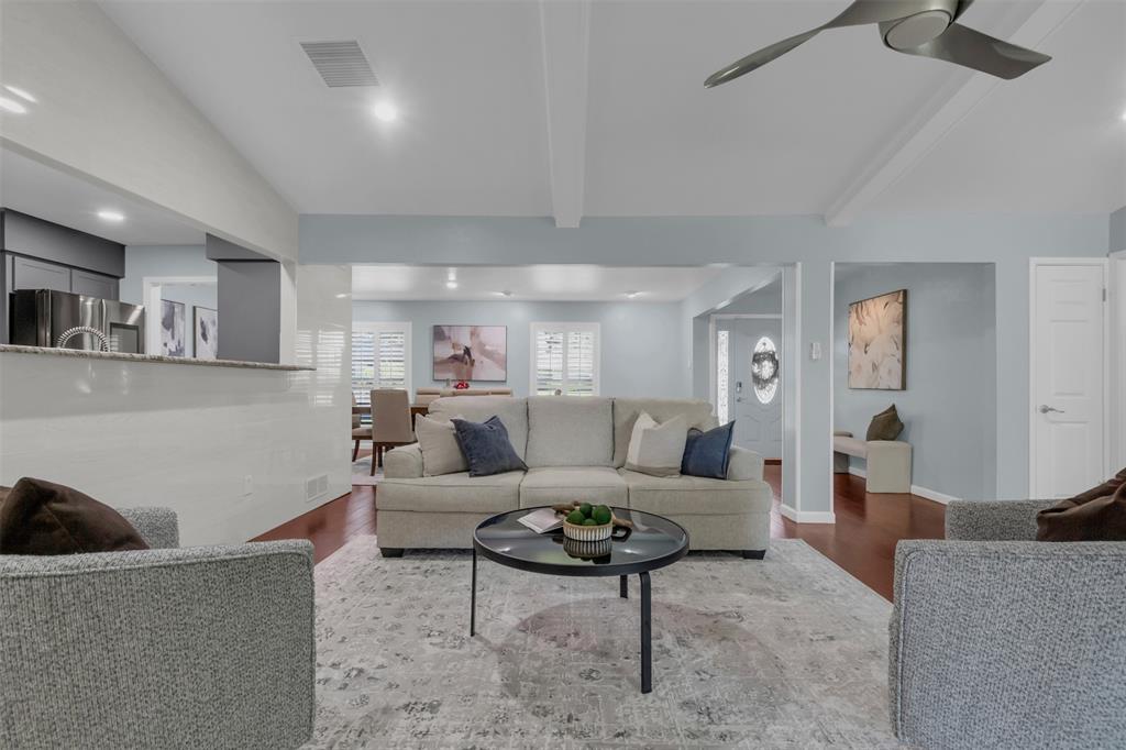 4808 Thunder Road Dallas, TX 75244 - Photo 14 of 36 a living room with furniture and a wooden floor