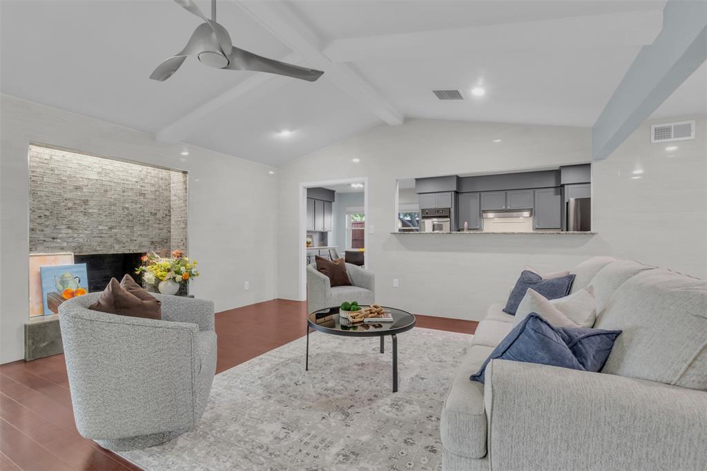 4808 Thunder Road Dallas, TX 75244 - Photo 3 of 36 a living room with furniture and a fireplace