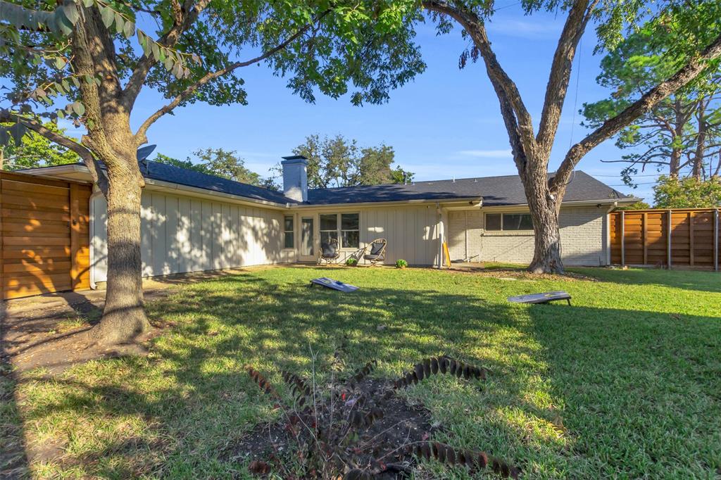 4808 Thunder Road Dallas, TX 75244 - Photo 7 of 36 a front view of a house with garden