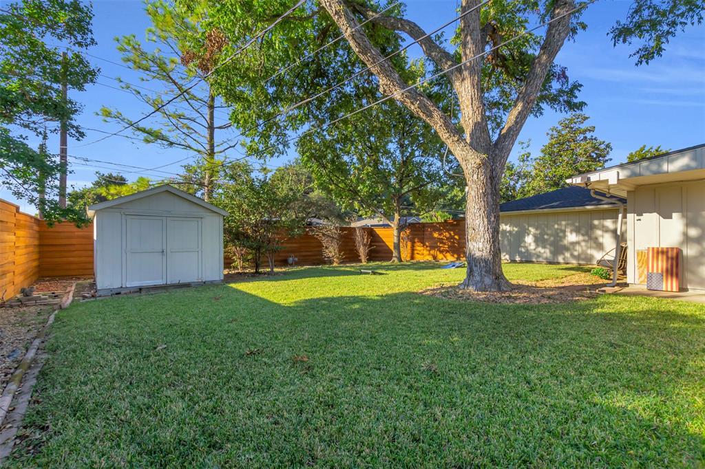 4808 Thunder Road Dallas, TX 75244 - Photo 10 of 36 a view of a house with a yard and tree s