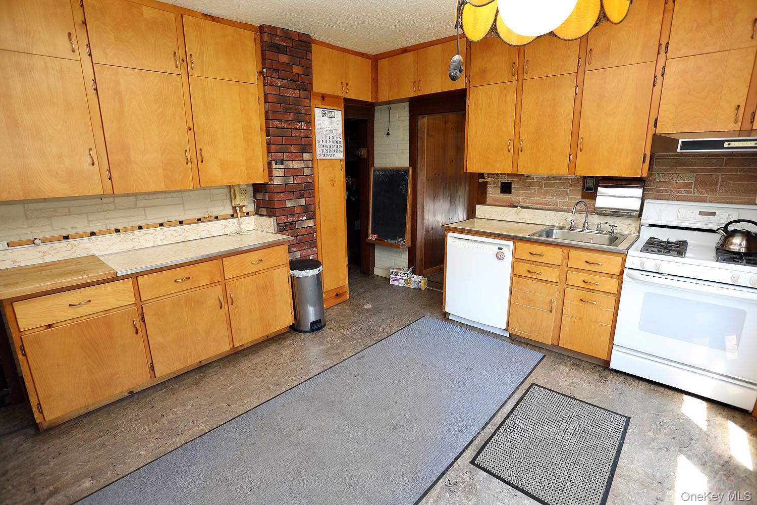 1779 Shandelee Road Livingston Manor, NY 12758 - Photo 8 of 31 Kitchen. Lots of cabinet and counter space. LP gas stove.