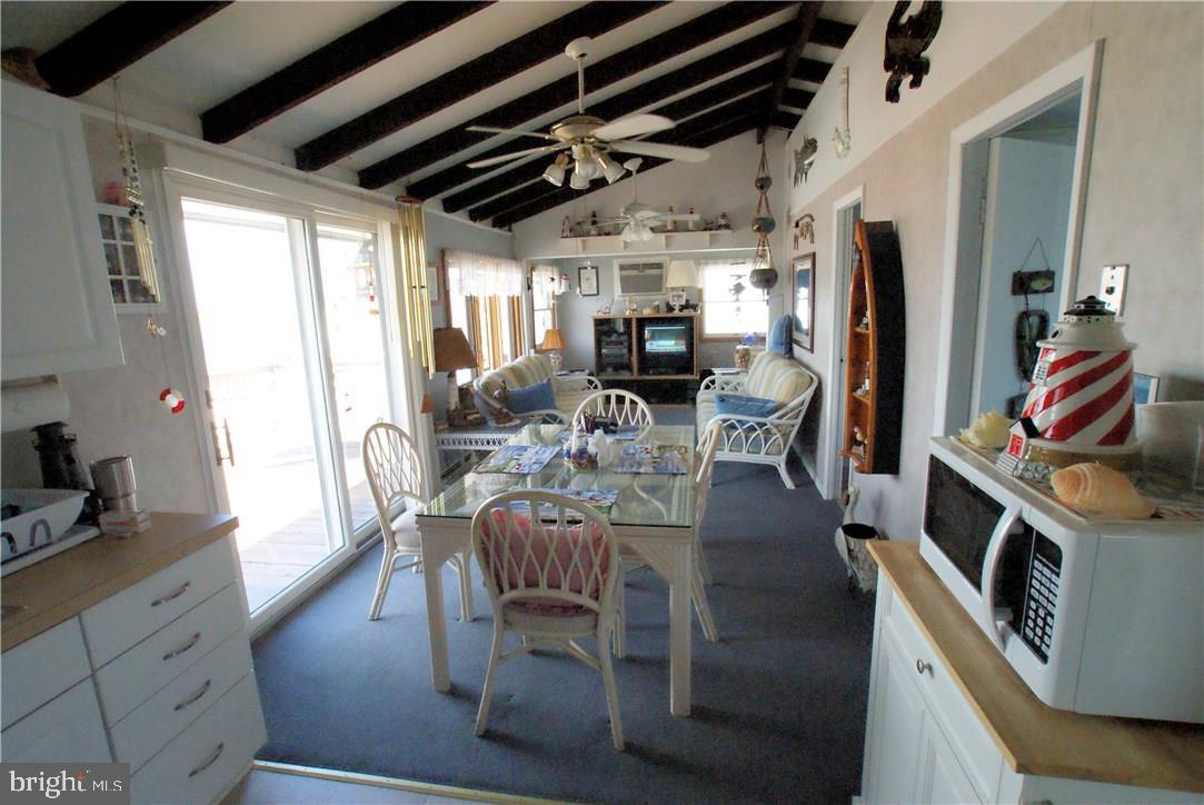 405 Kingfisher Road Tuckerton, NJ 08087 - Photo 10 of 16 a view of a kitchen with furniture and a window