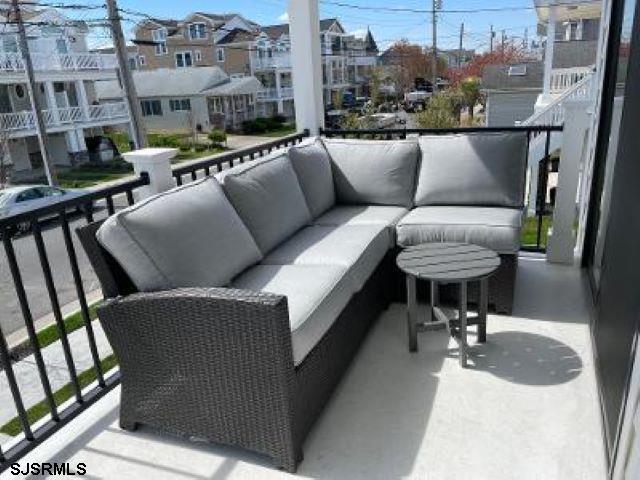 103 North Monroe Avenue, Unit MAY 15TH 2026JULY 31ST 2026 Margate City, NJ 08402 - Photo 13 of 33 a view of balcony with furniture