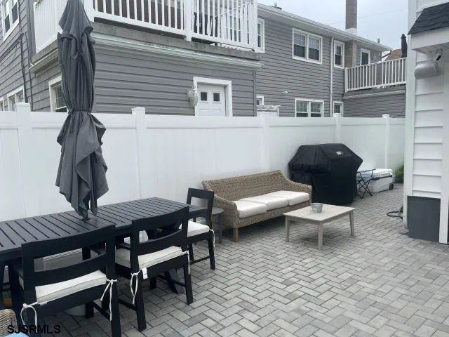 a outdoor space with a couch and chairs