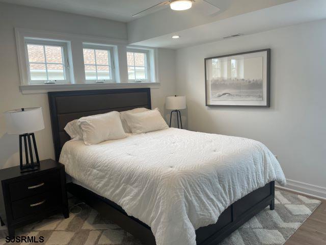 103 North Monroe Avenue, Unit MAY 15TH 2026JULY 31ST 2026 Margate City, NJ 08402 - Photo 24 of 33 a bedroom with a bed and window