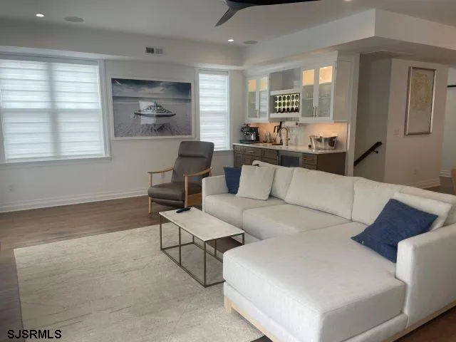 a living room with furniture and windows