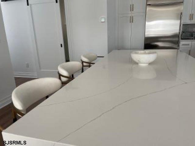 103 North Monroe Avenue, Unit MAY 15TH 2026JULY 31ST 2026 Margate City, NJ 08402 - Photo 10 of 33 a bedroom with a bed and a couch