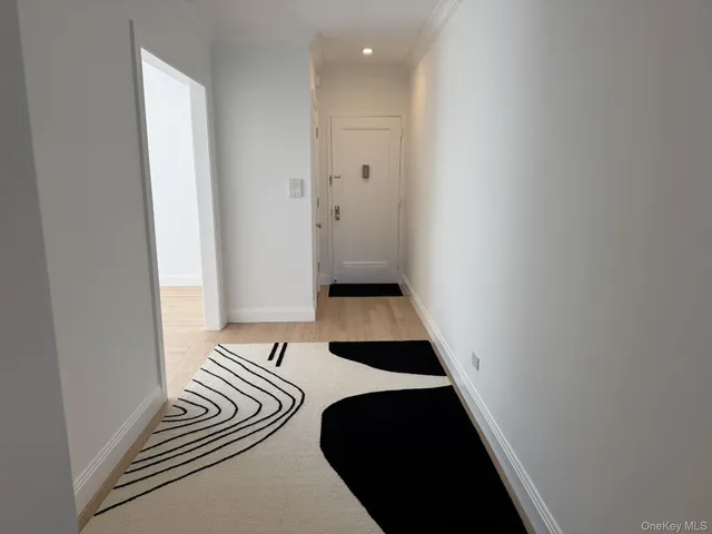 a view of bedroom with a bed and wooden floor