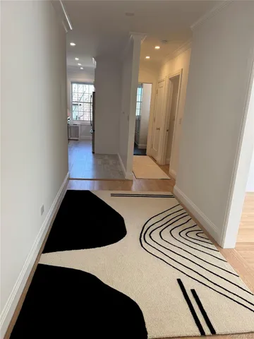 a bedroom with a bed and a mirror