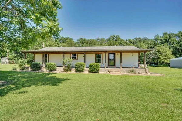 front view of a house with a yard