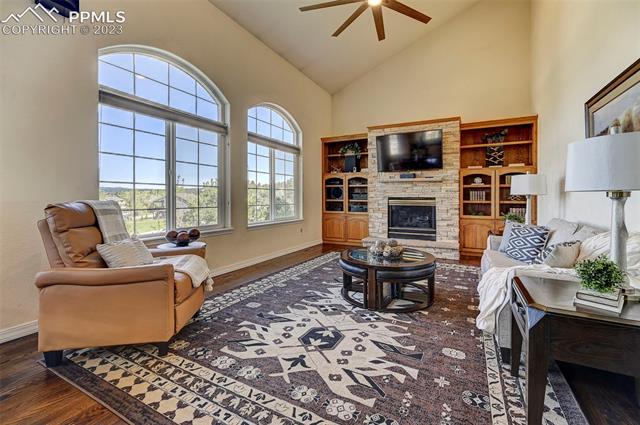 18465 Lower Lake Road Monument, CO 80132 - Photo 1 of 12 Family room w/ vaulted ceiling, new fan, built-ins and updated fireplace